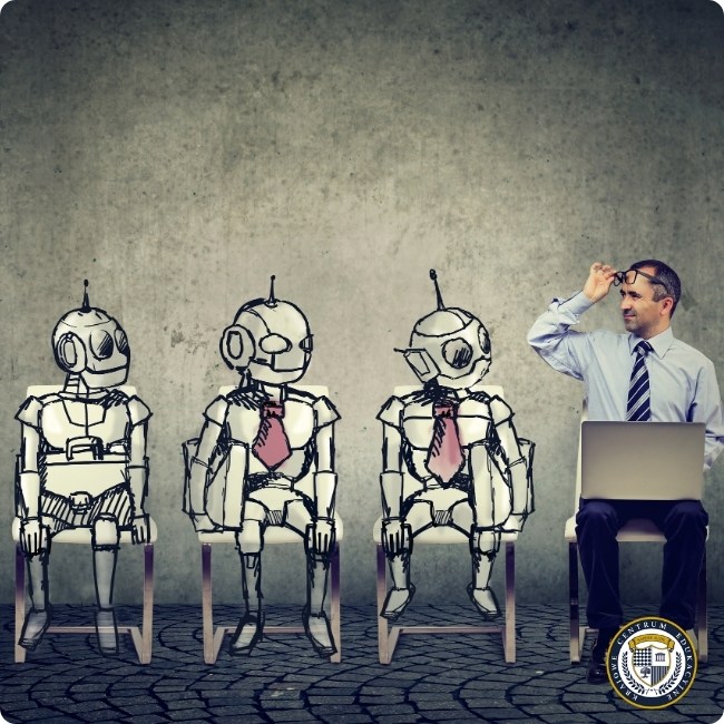 Biznesmen z laptopem siedzący obok narysowanych robotów w krawatach, ilustrujący zastosowanie sztucznej inteligencji w miejscu pracy