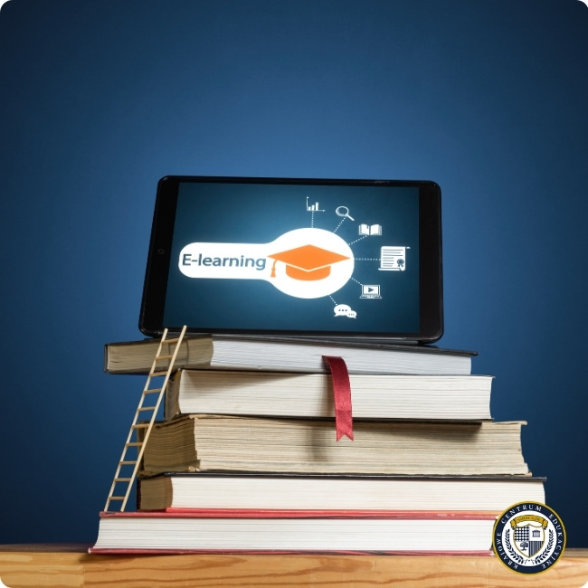 Tablet z grafiką e-learningu umieszczony na stosie książek. Nowoczesne formy szkoleń łączące tradycyjną wiedzę z technologią cyfrową.
