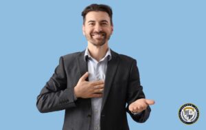 Mowa rąk - dłoń na sercu, a druga wyciągnięta